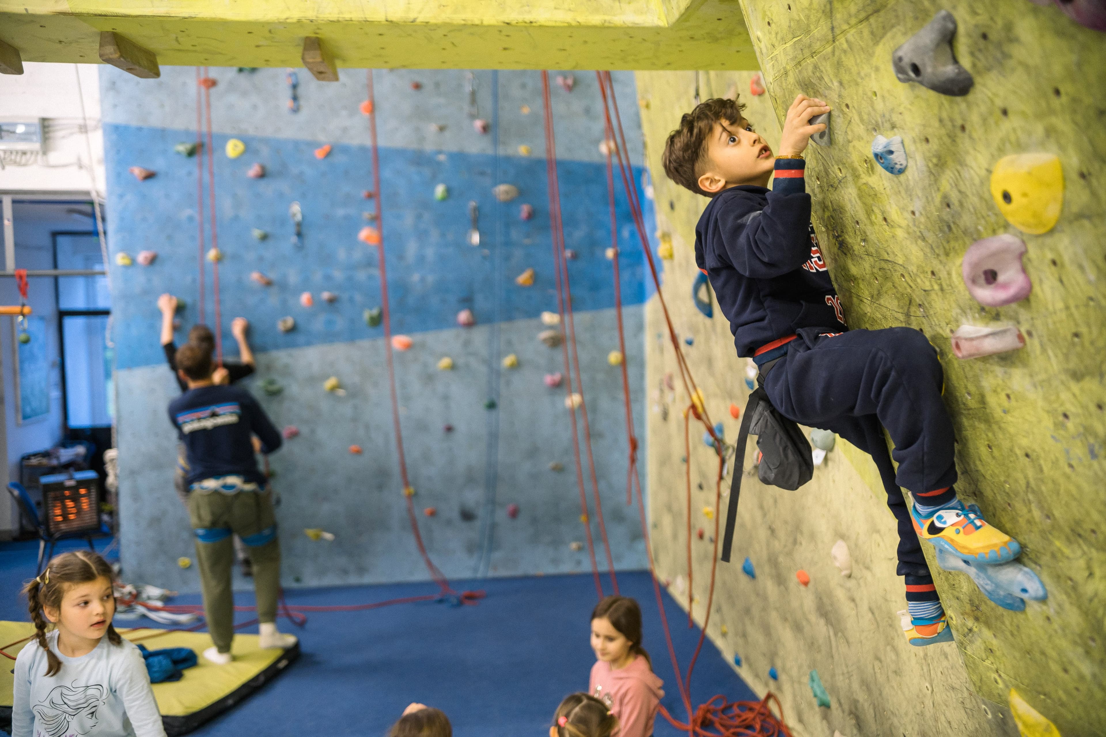 Child climbing the gym wall