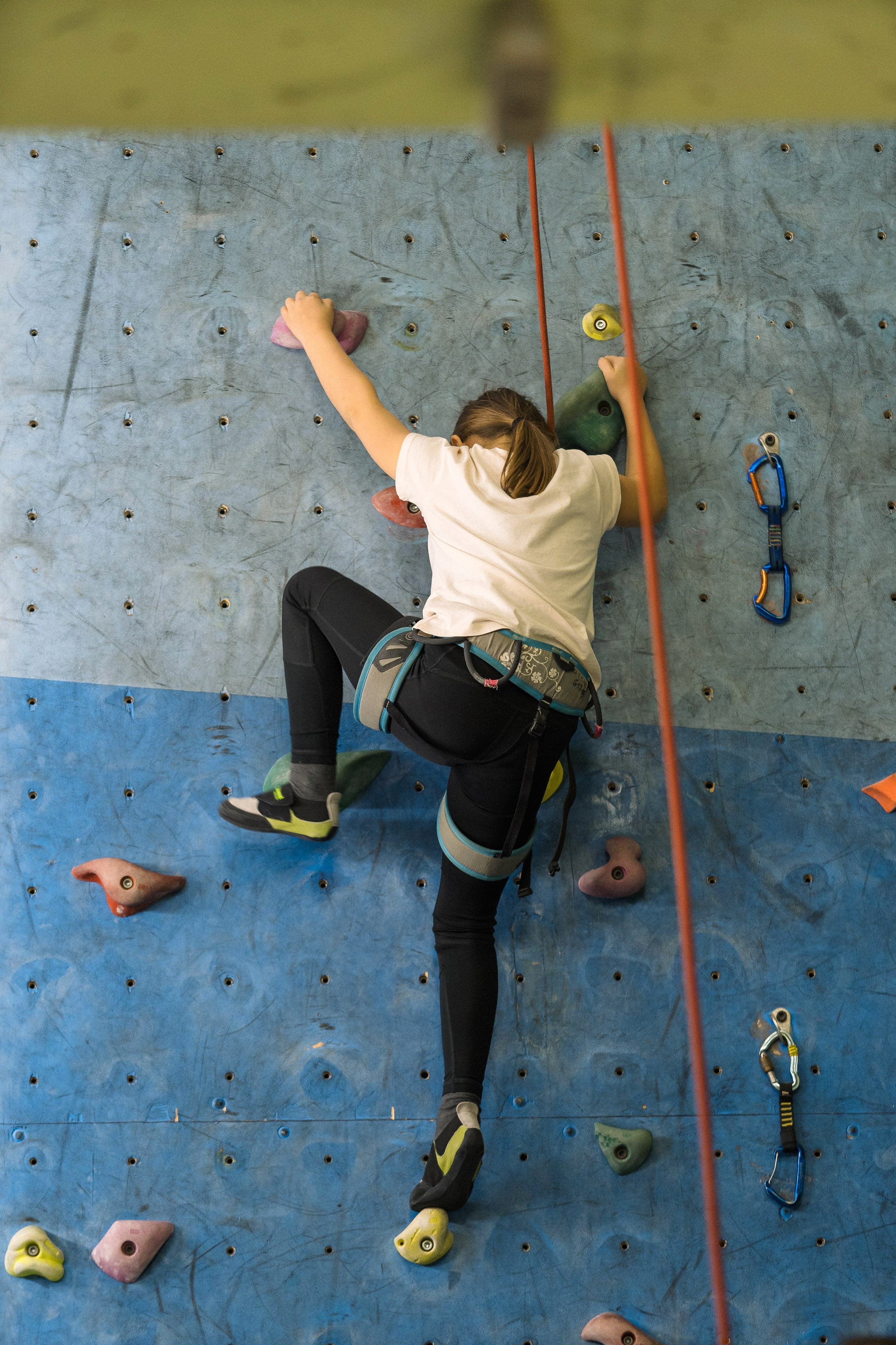 Child climbing the gym wall